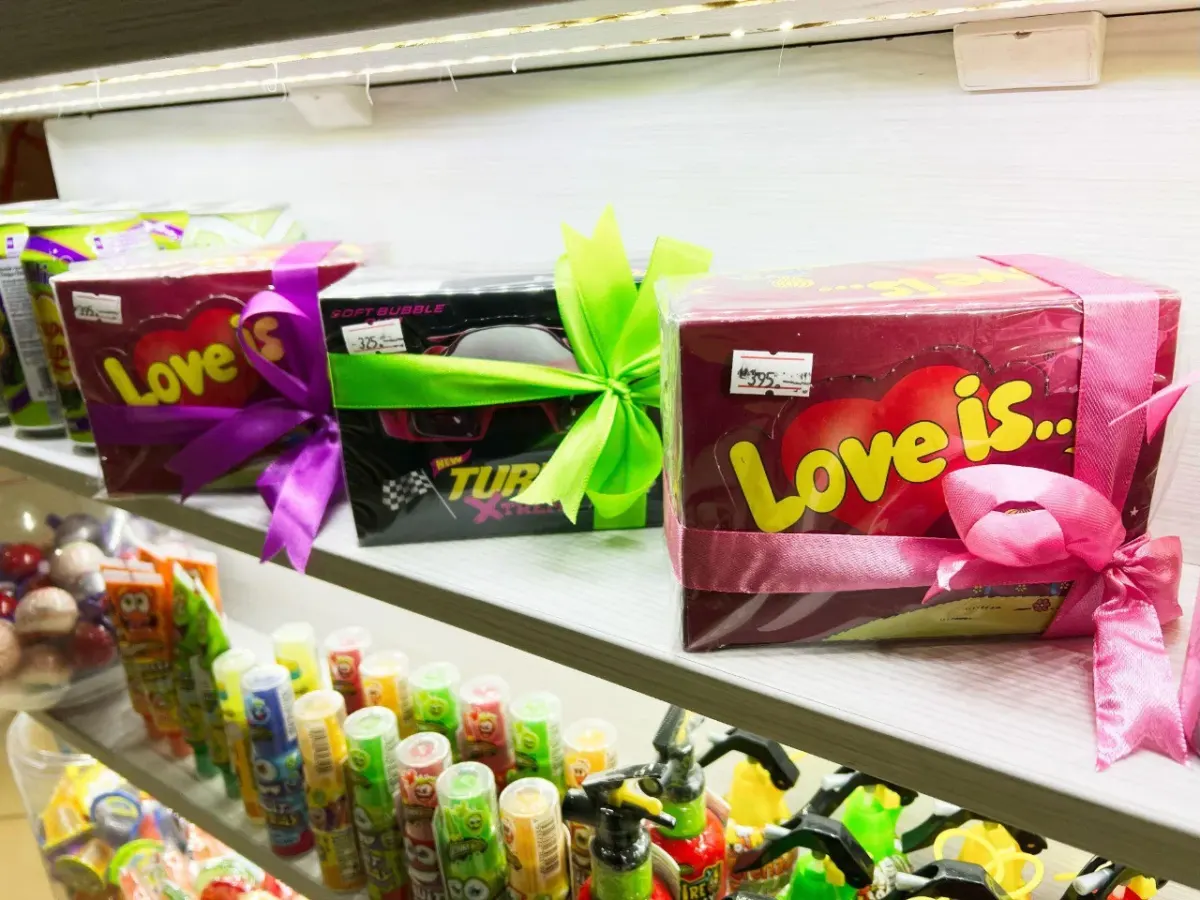 Decorative shelf with gift boxes and toys used as a generic hero image for a page about MobileAction pricing questions for game growth teams