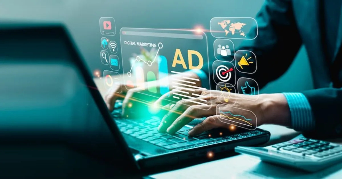 Person typing on a laptop with digital ad icons overlay, representing work on game ad creative production Person typing on a laptop with digital ad icons overlay, representing work on game ad creative production