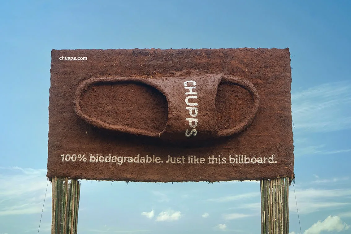 Billboard-style sign reading CHUPS with slogan about being 100% biodegradable, used as a metaphor for sustainable gaming UA partnerships Billboard-style sign reading CHUPS with slogan about being 100% biodegradable, used as a metaphor for sustainable gaming UA partnerships