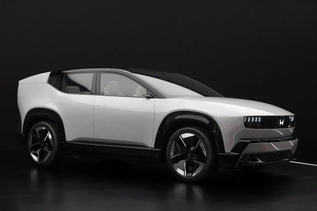 Side view of a white car on a dark background, used as a generic visual for a mobile game creator program page