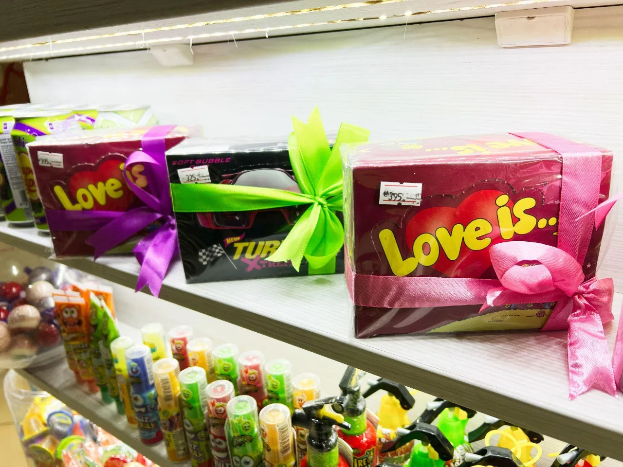 Shelf with gift boxes and toys on display, used as a decorative hero image for a growth marketing manager in an iGaming brand